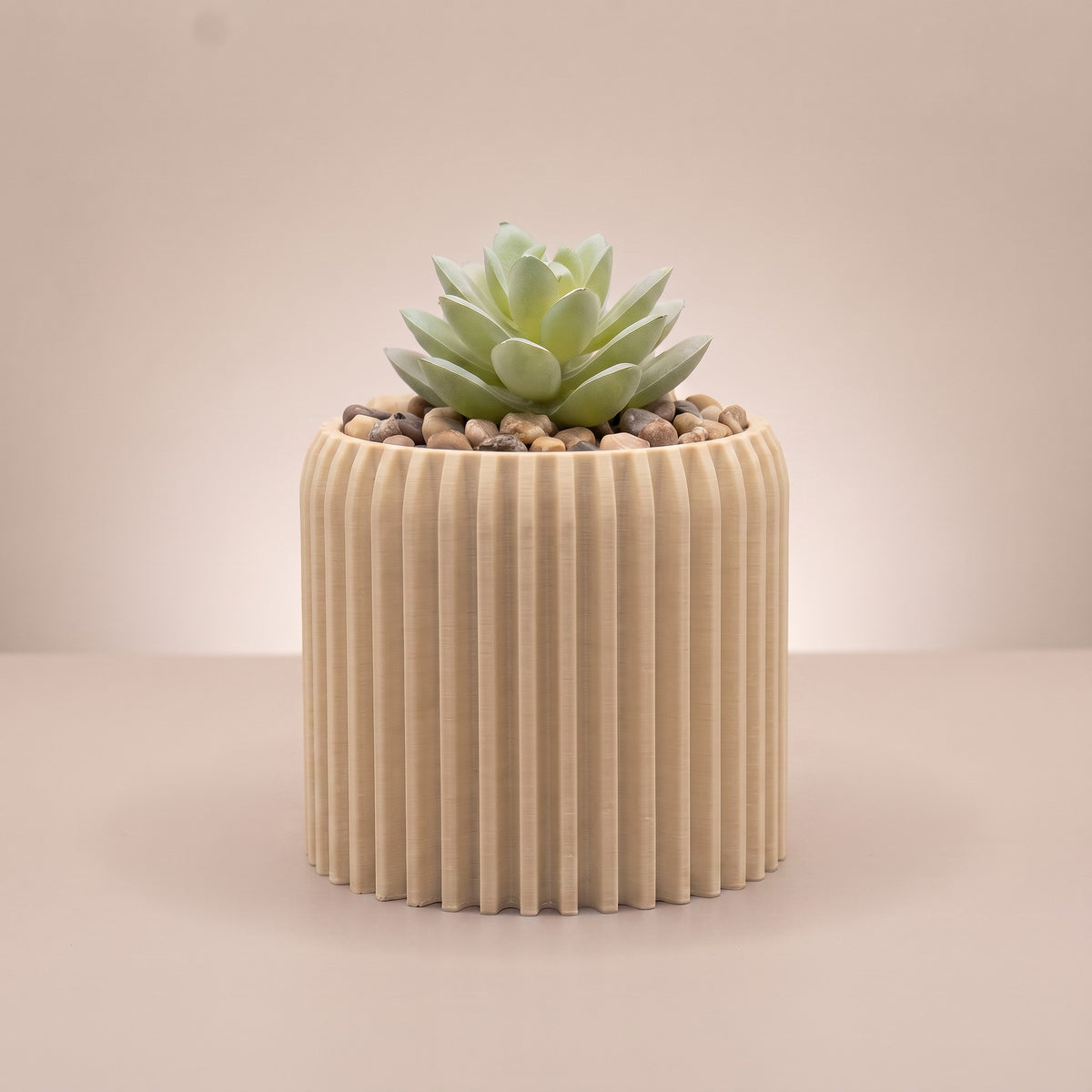 Flute planter in Golden Sand with artificial succulent and real pebbles, 3D printed in Sydney